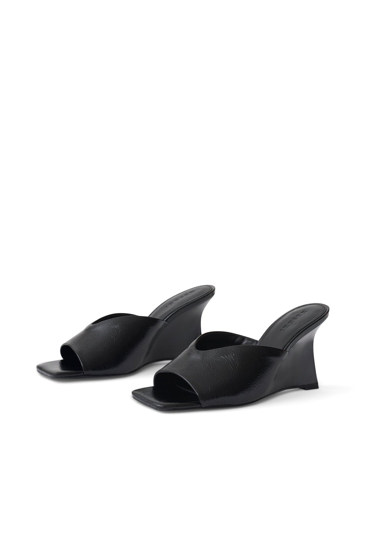 A pair of black leather wedge mule sandals with a square toe, displayed on a clean white background.