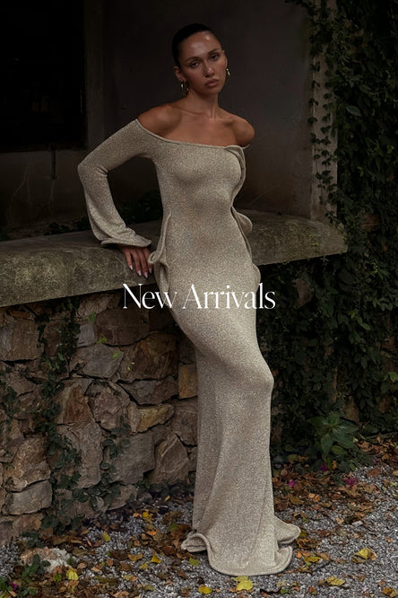 Woman in gold off-shoulder dress.