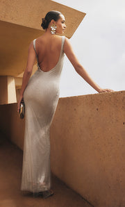 Image of woman in silver maxi dress.
